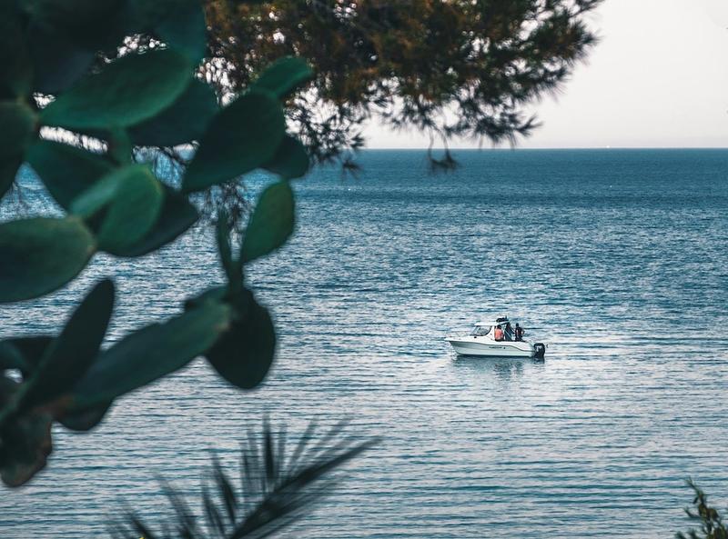 Boat with engine failure lies still at sea